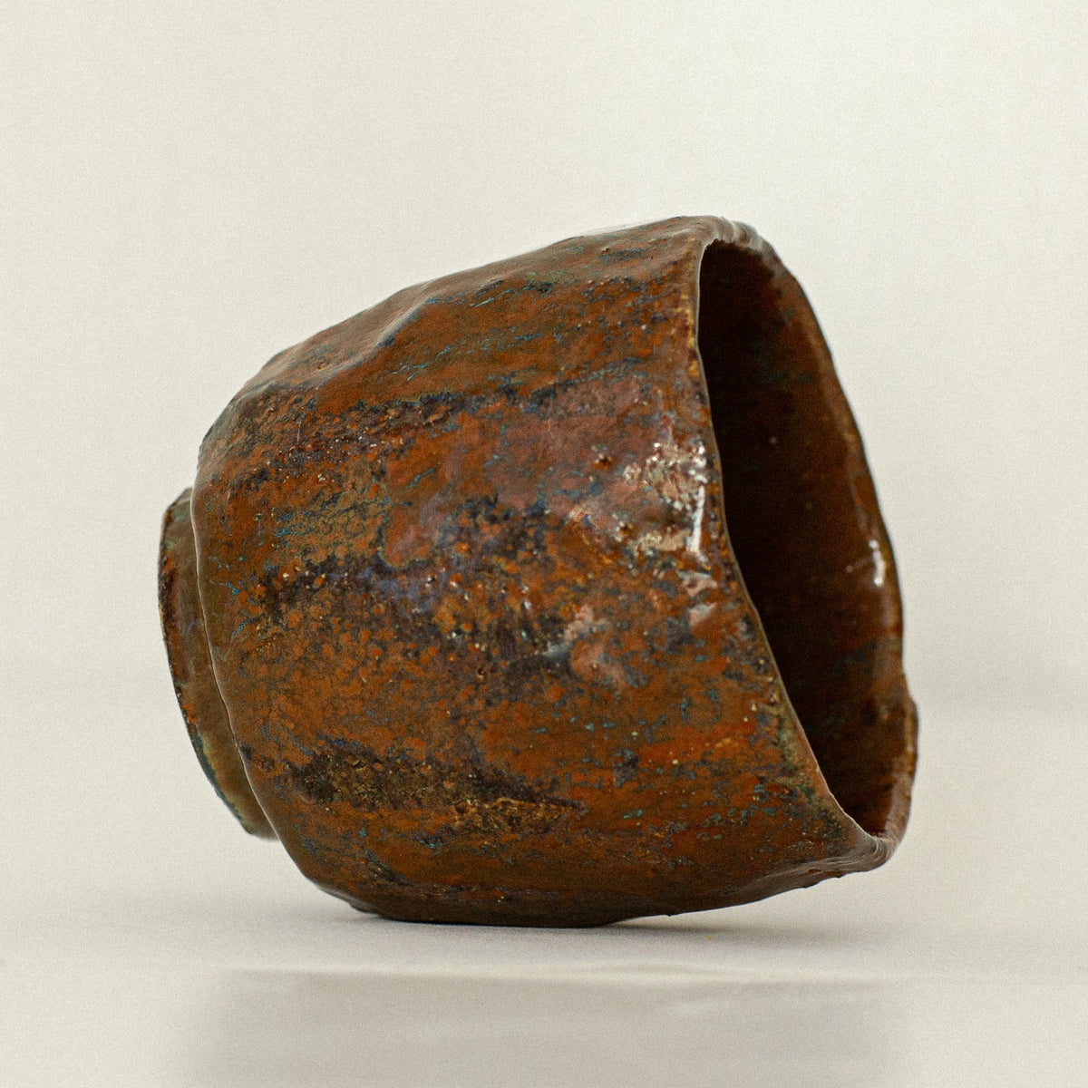 Earth Cup no. 04 handmade stoneware cup by artist Tania Ruda, angled view