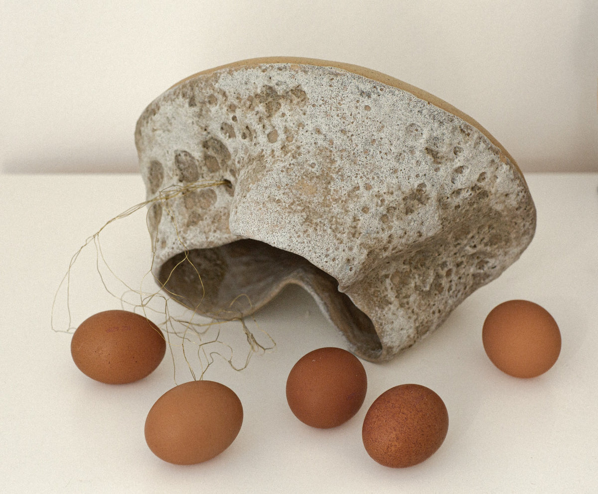 Sculptural ceramic vessel with organic form and textured surface