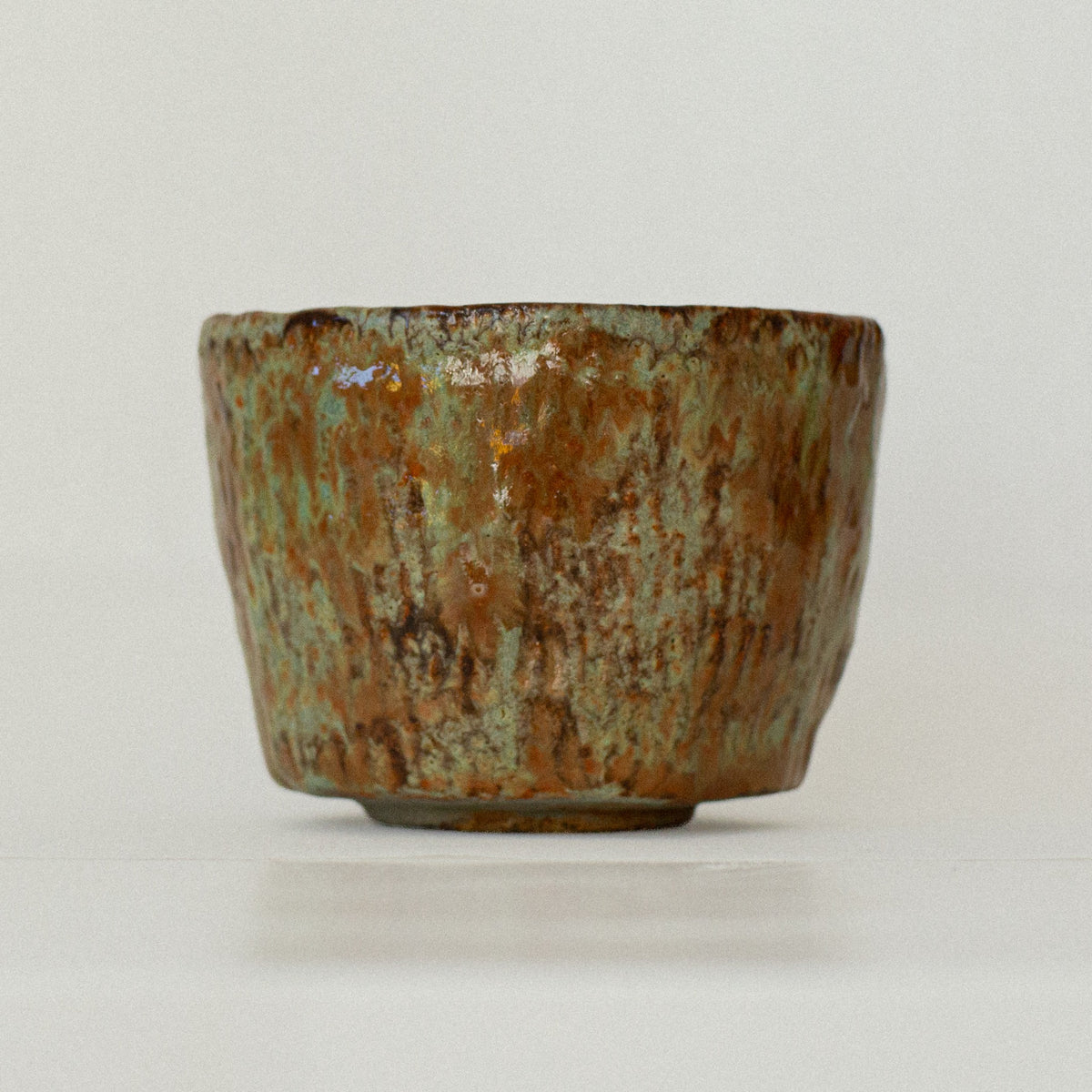 Earth Cup no. 01 handmade stoneware cup by artist Tania Ruda, front view