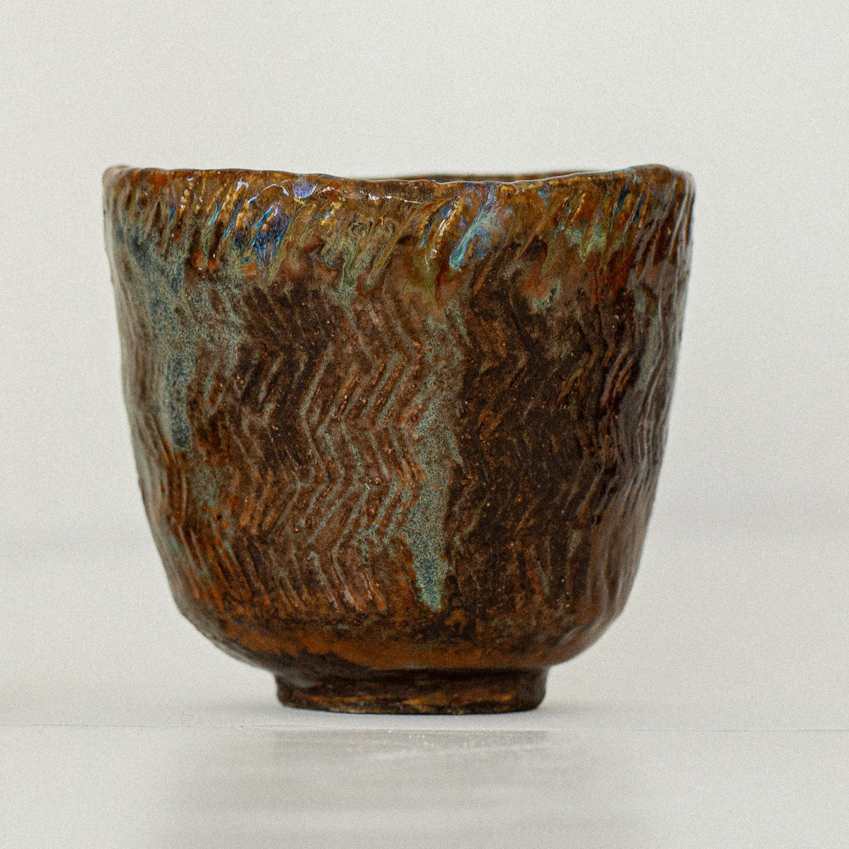 Earth Cup no. 02 handmade stoneware cup by artist Tania Ruda, front view