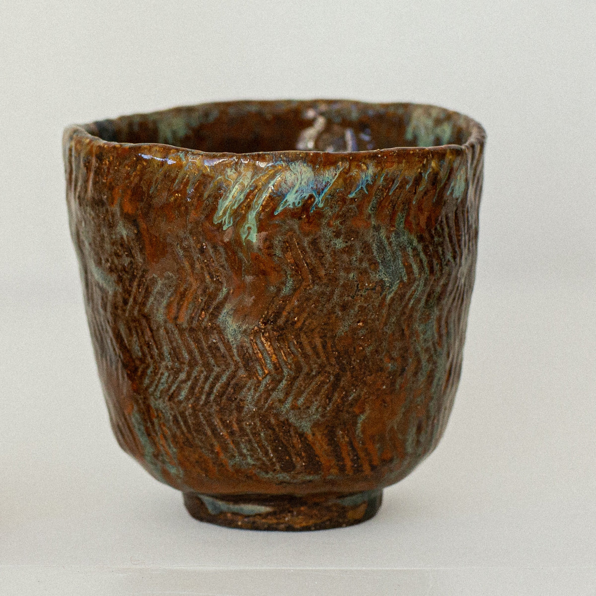 Earth Cup no. 02 handmade stoneware cup by artist Tania Ruda, side view