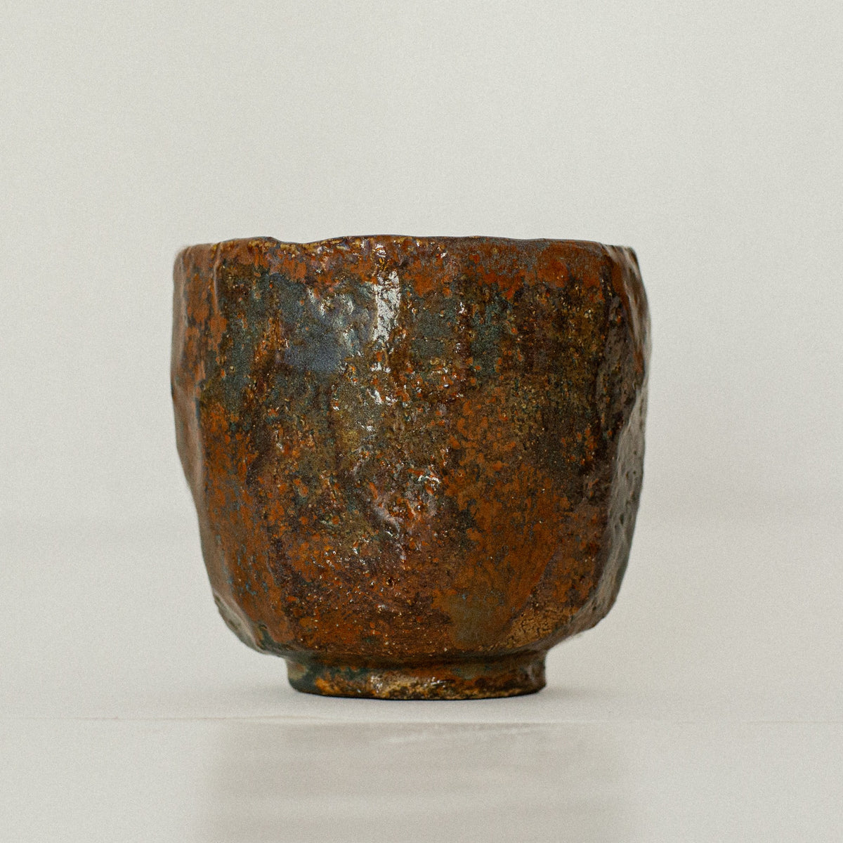 Earth Cup no. 04 handmade stoneware cup by artist Tania Ruda, front view