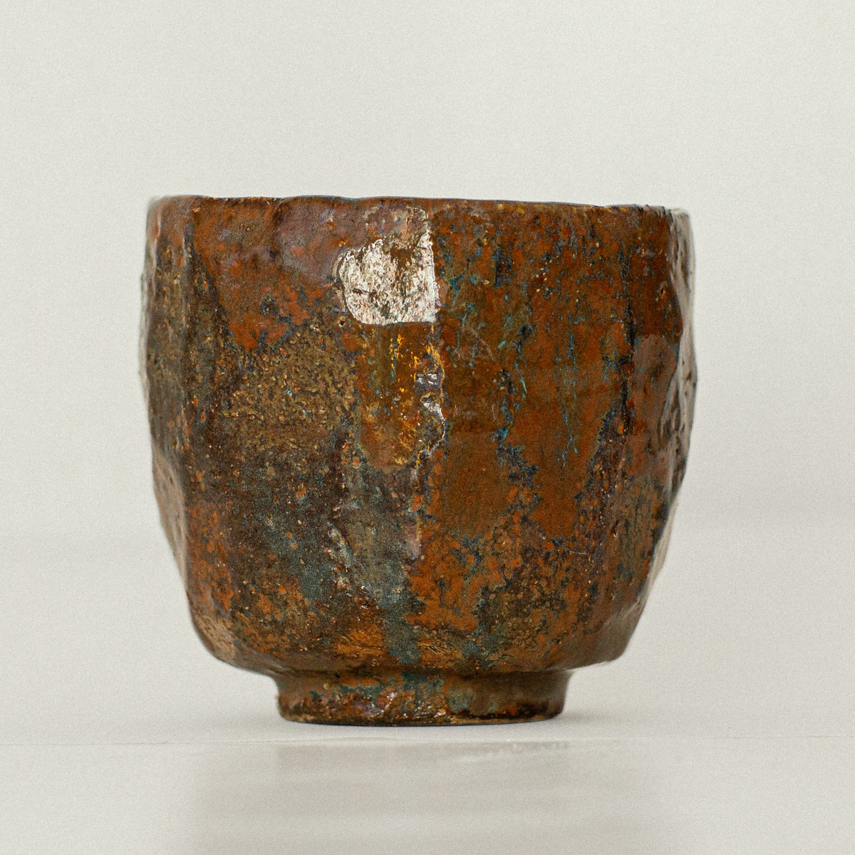 Earth Cup no. 04 handmade stoneware cup by artist Tania Ruda, side view
