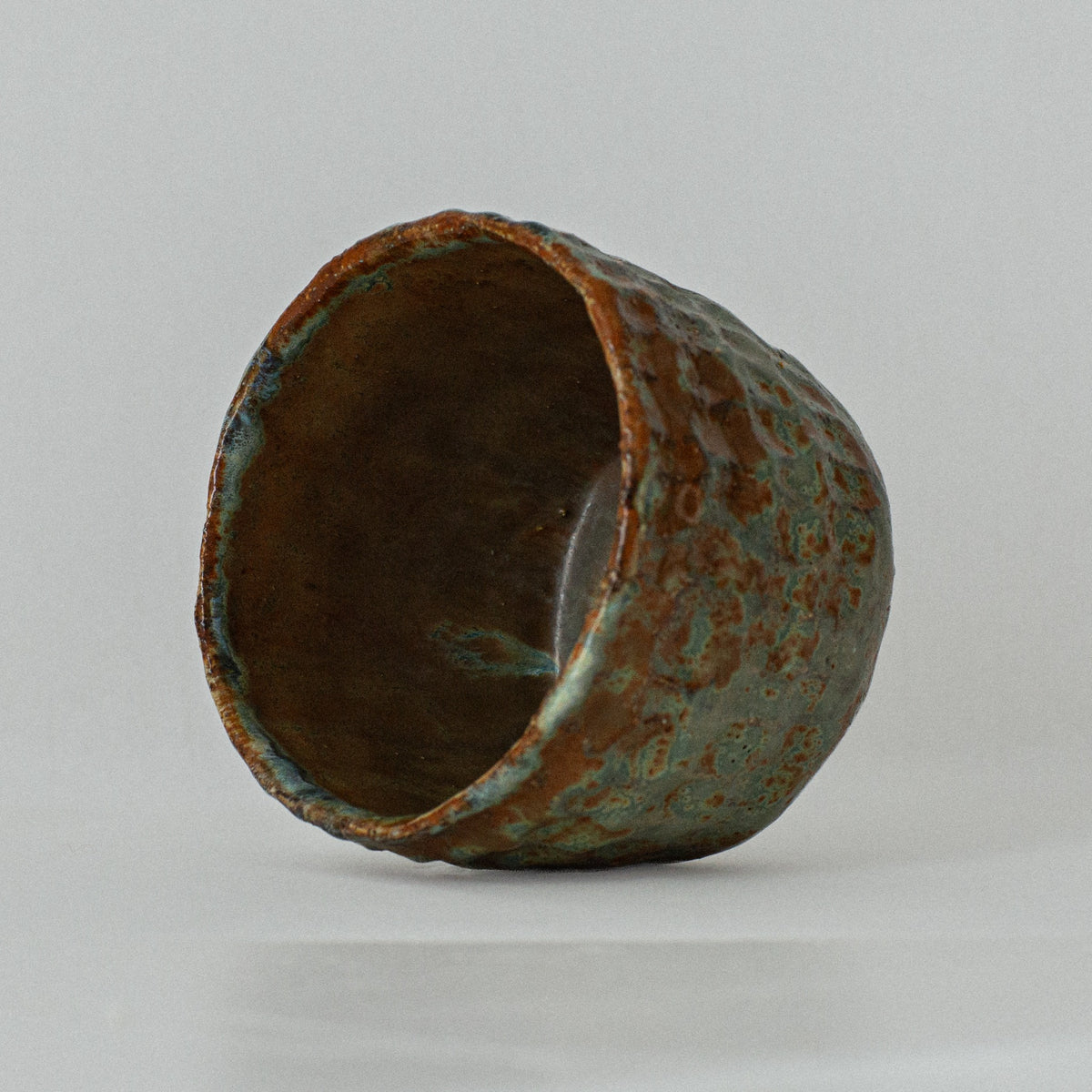 Earth Cup no. 05 handmade stoneware cup by artist Tania Ruda, side view