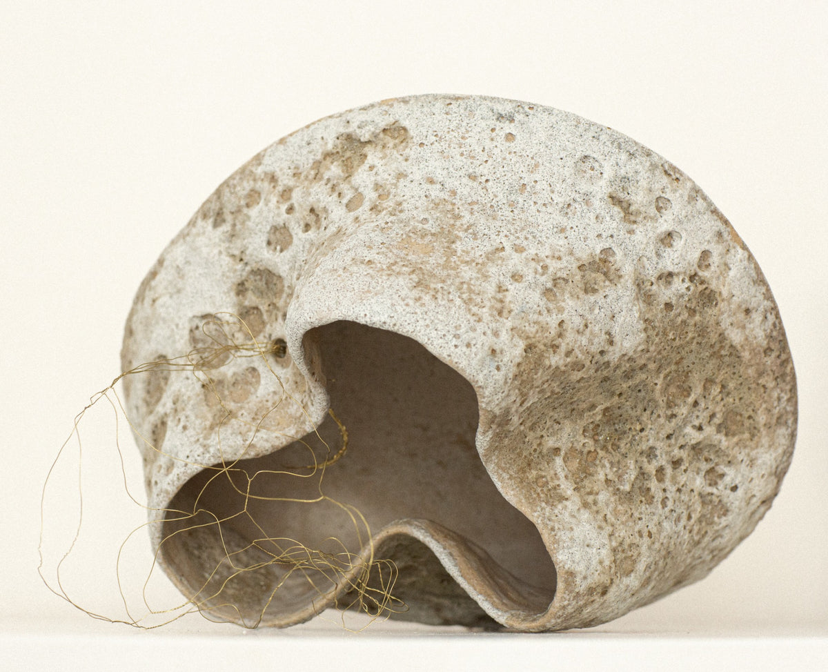 Sculptural ceramic vessel, side view with organic opening
